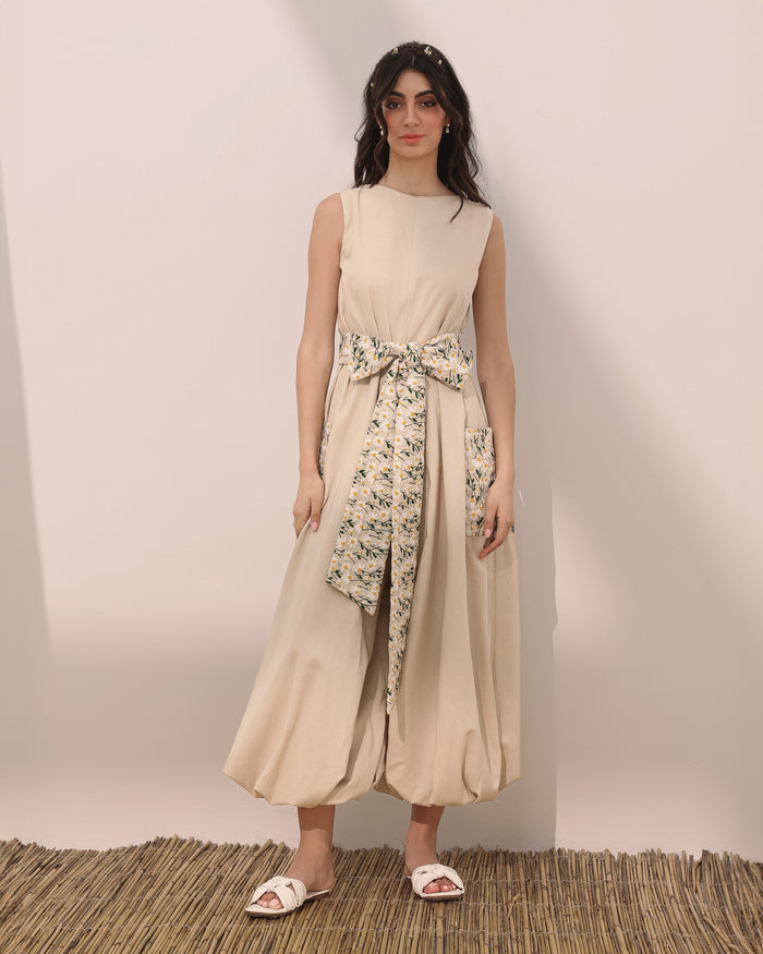 Sleeveless linen balloon jumpsuit w/ embroidered daisy flowers on pockets and belt