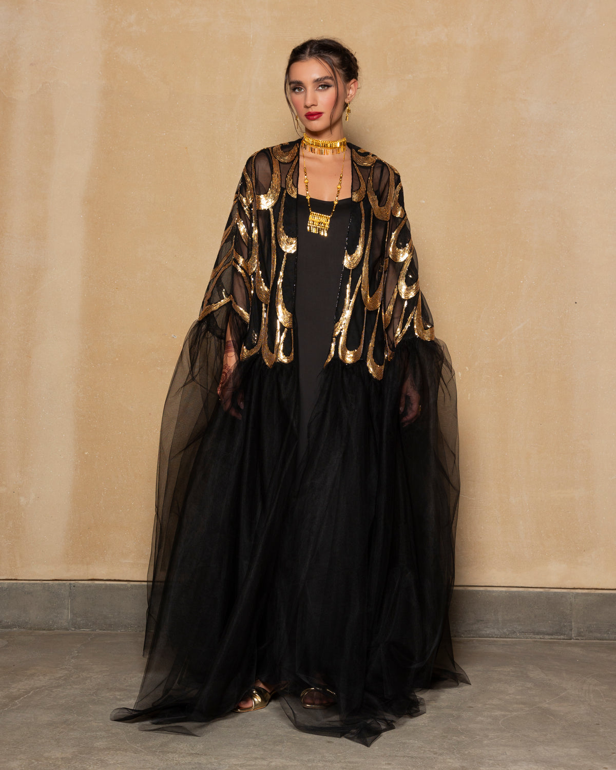 Embroidered tulle abaya in gold + black with cape sillhoute