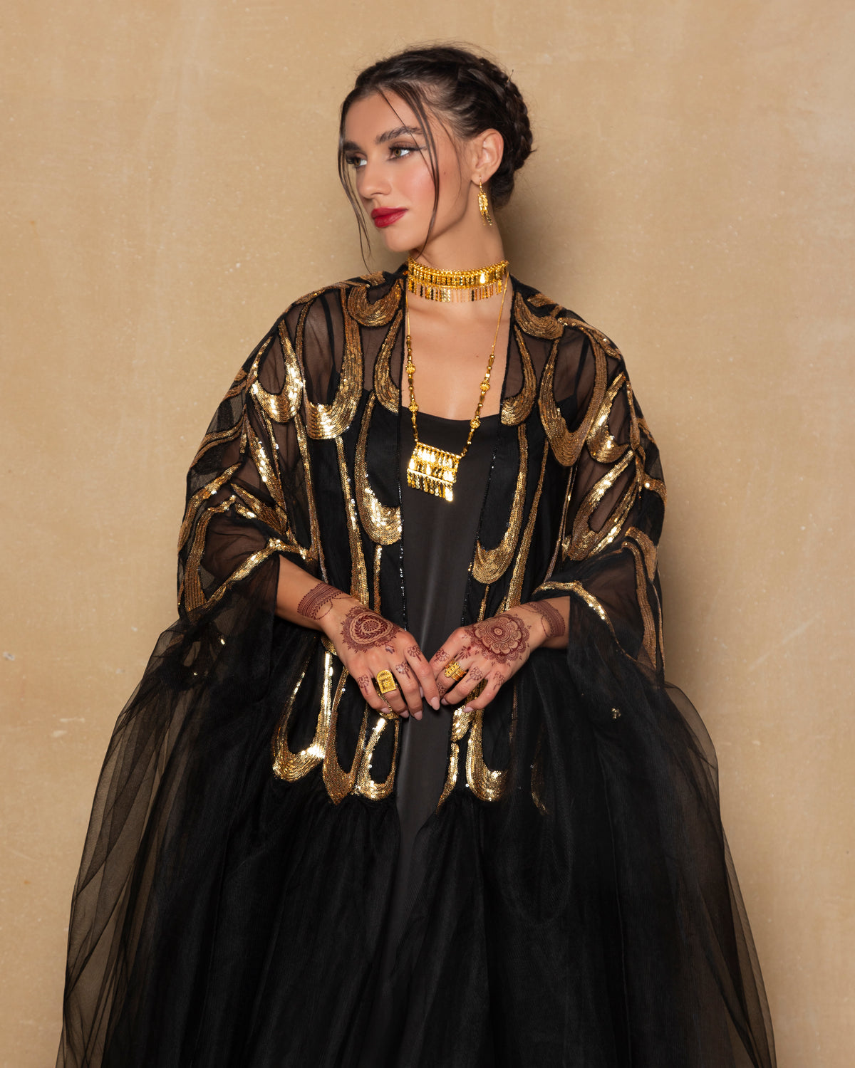 Embroidered tulle abaya in gold + black with cape sillhoute