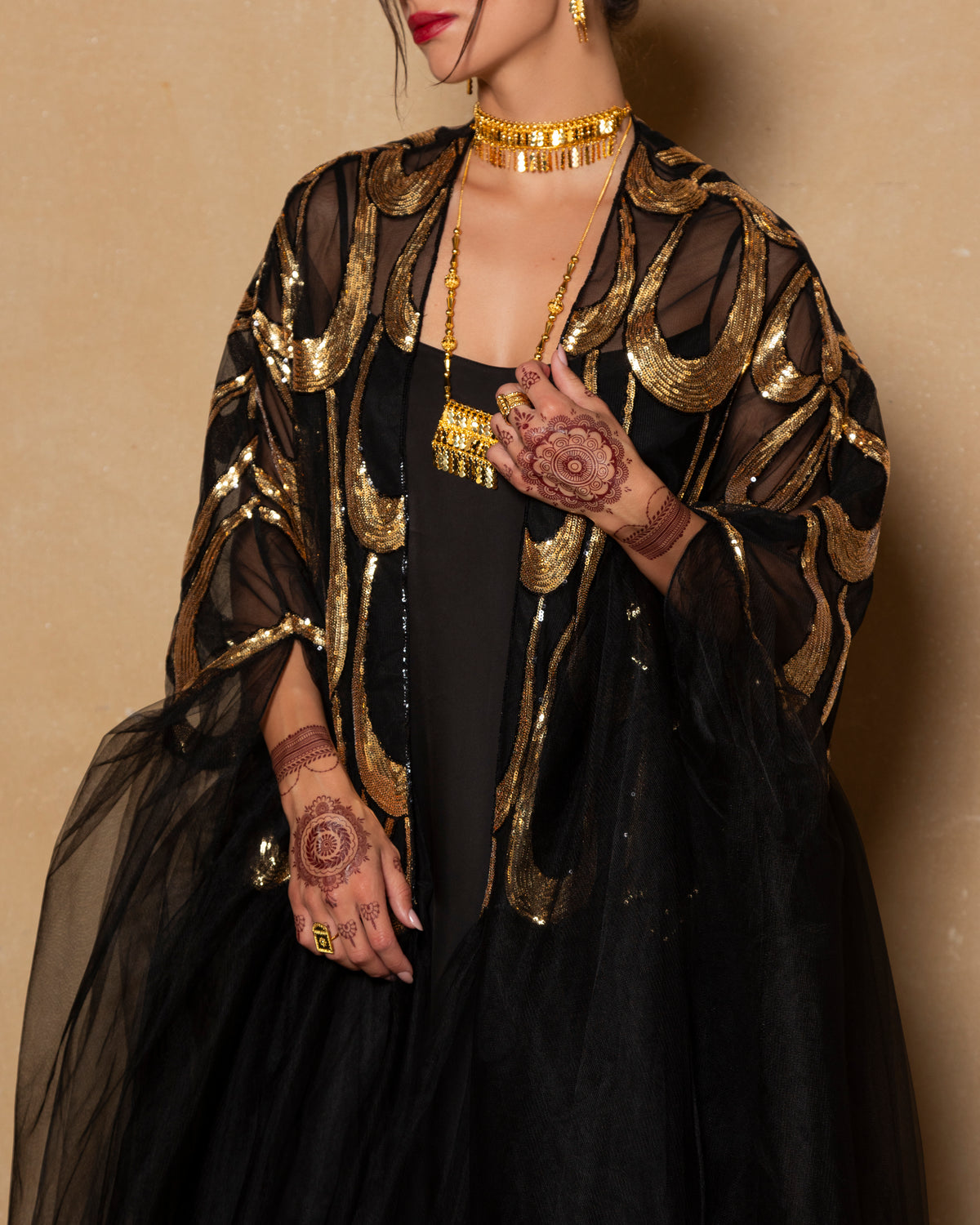 Embroidered tulle abaya in gold + black with cape sillhoute