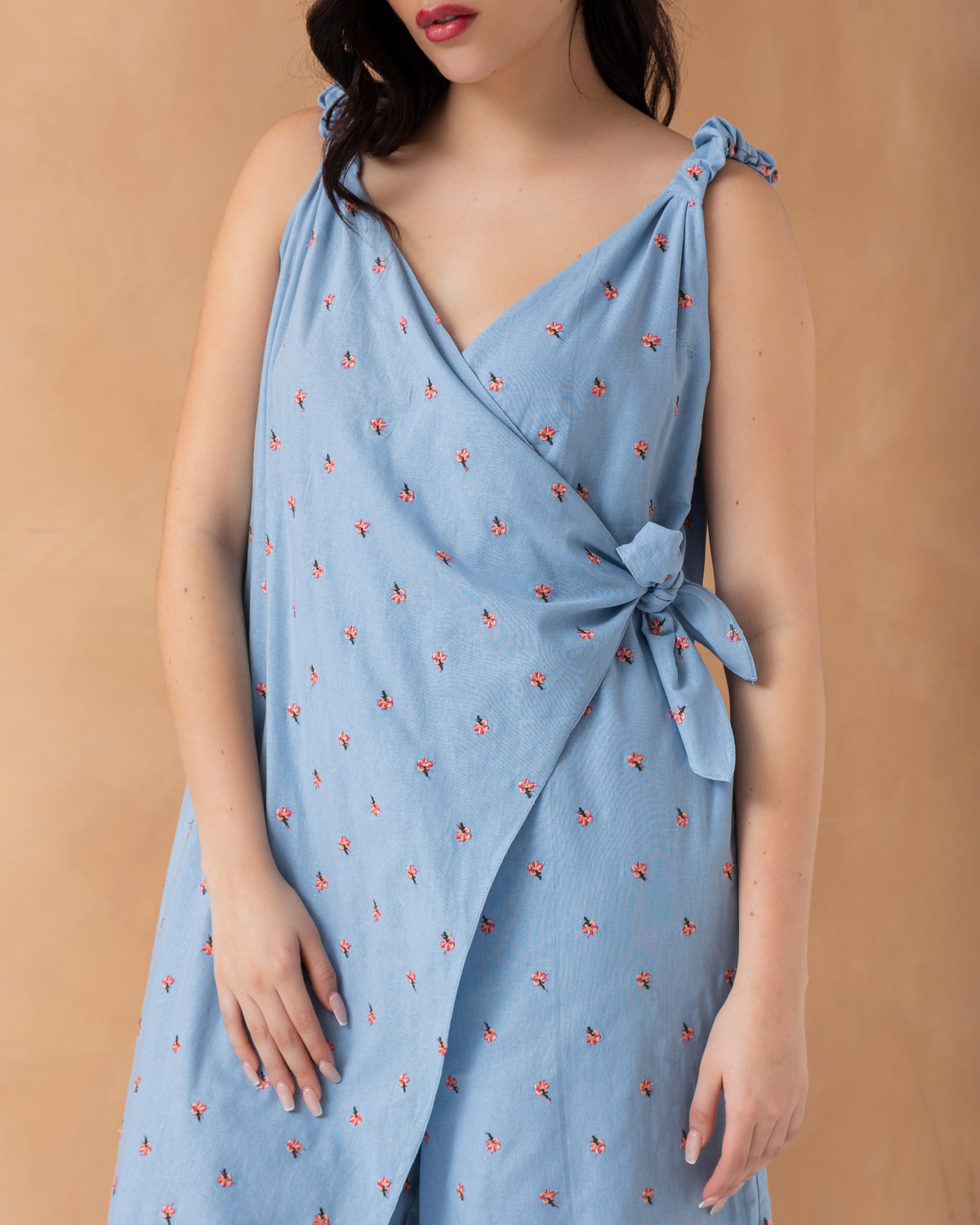 Sleeveless overlapped cotton jumpsuit with mini embroidered flowers