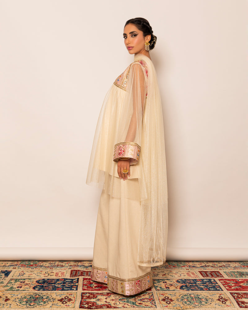 Shiny tulle top with embellished trimmings around neckline & linen wide legged pants with embellished trim hemline