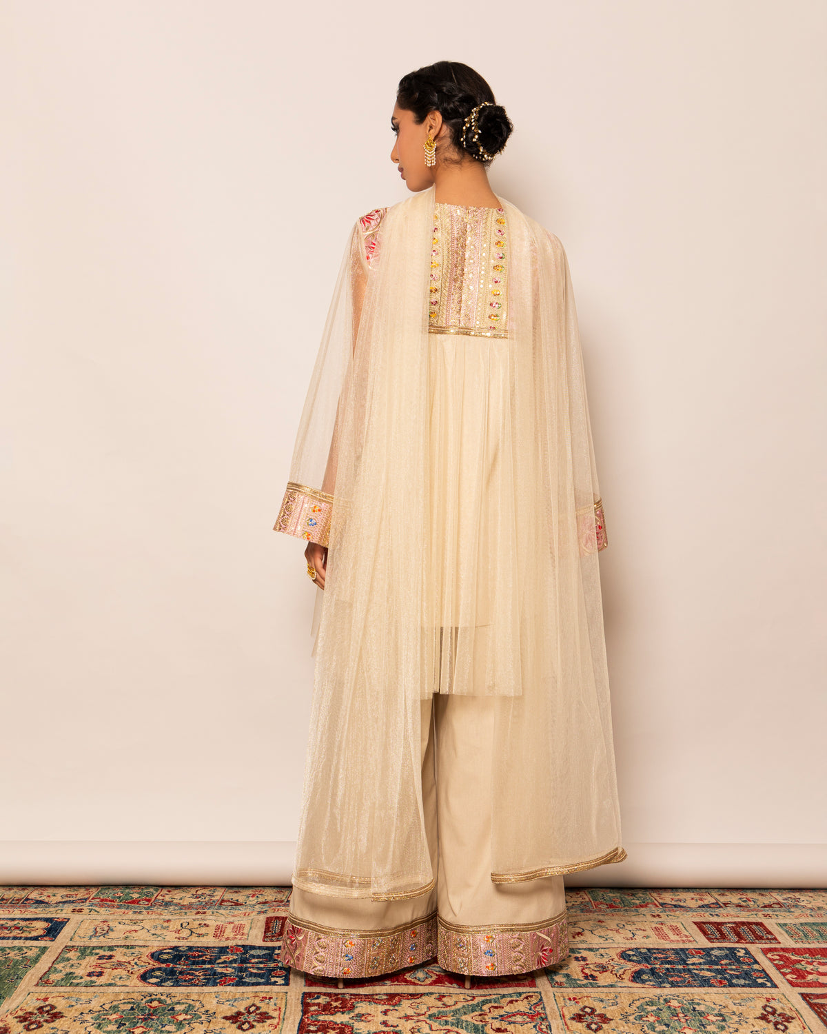 Shiny tulle top with embellished trimmings around neckline & linen wide legged pants with embellished trim hemline