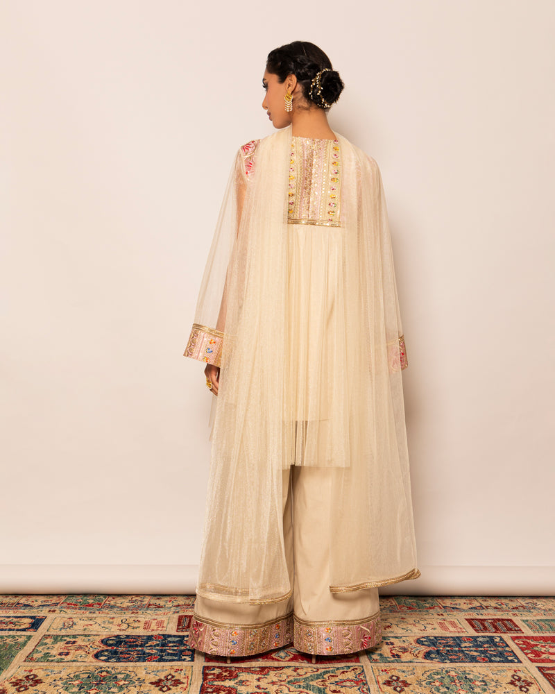 Shiny tulle top with embellished trimmings around neckline & linen wide legged pants with embellished trim hemline