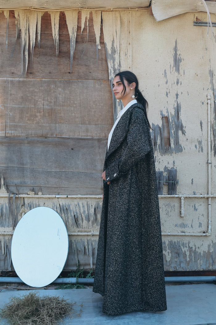 Silk wool abaya with silver metallic thread abaya, big lapel, elongated back vent, and oversized cuff with silver buttons