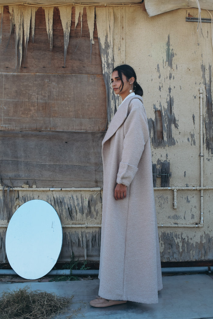 Silk wool abaya with silver metallic thread abaya, big lapel, elongated back vent, and oversized cuff with silver buttons