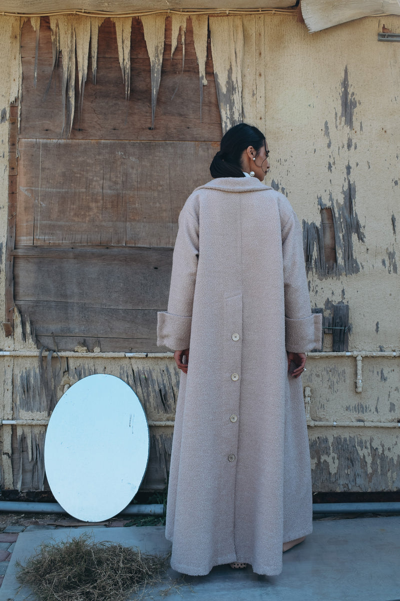 Silk wool abaya with silver metallic thread abaya, big lapel, elongated back vent, and oversized cuff with silver buttons