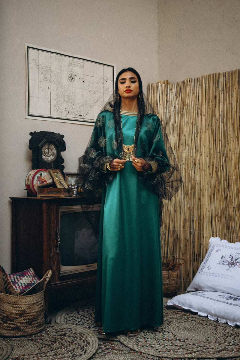 Traditional kaftan in silk with semi puffed sleeve with trimmings in cuff and neckline