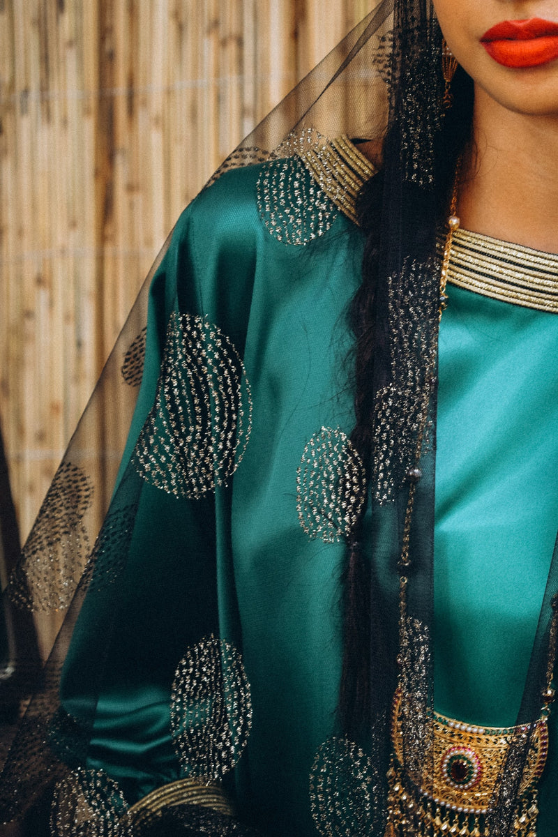 Traditional kaftan in silk with semi puffed sleeve with trimmings in cuff and neckline