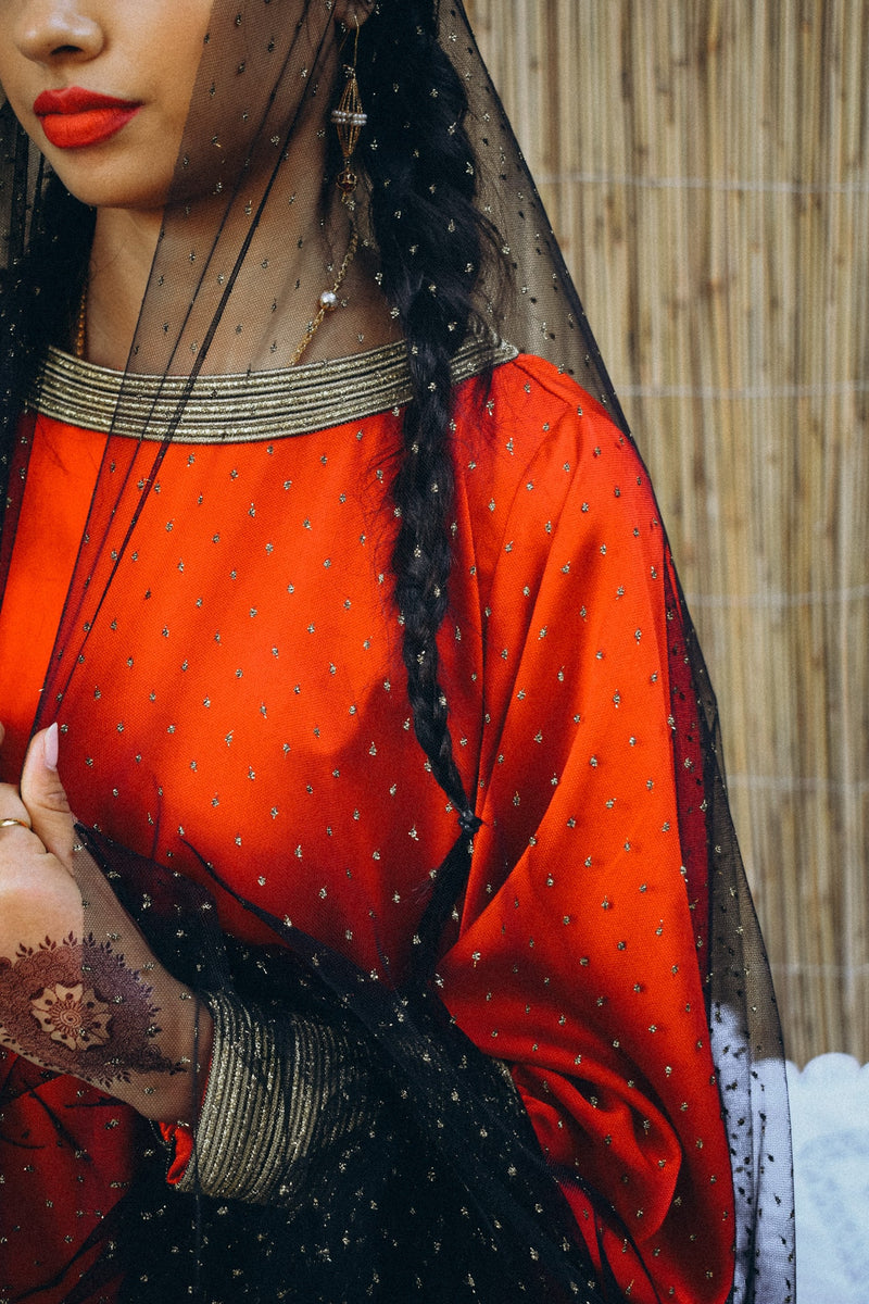 Traditional kaftan in silk with semi puffed sleeve with trimmings in cuff and neckline