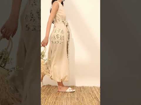 Sleeveless linen balloon jumpsuit w/ embroidered daisy flowers on pockets and belt